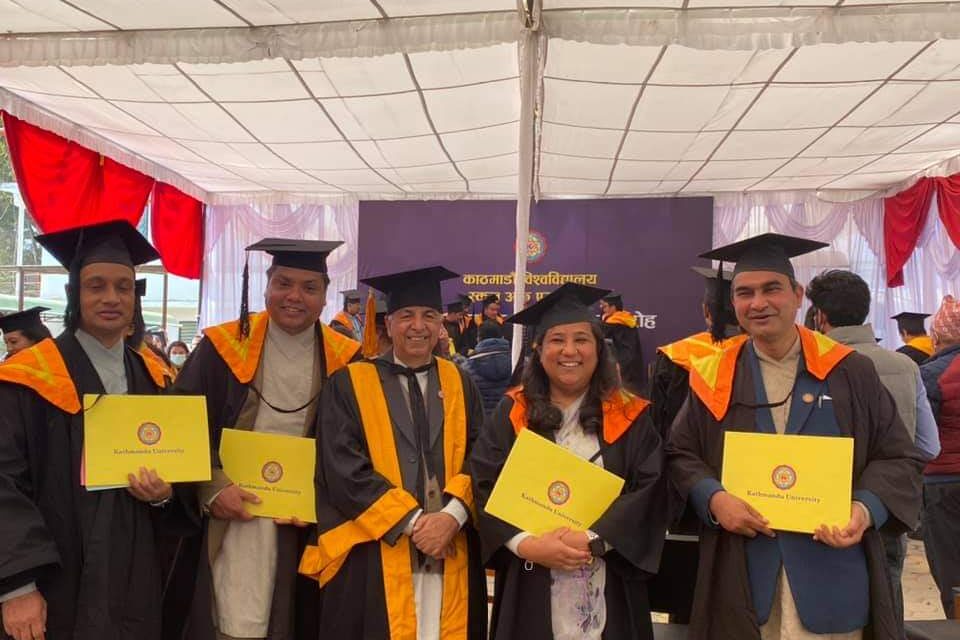 4 graduates with the dean