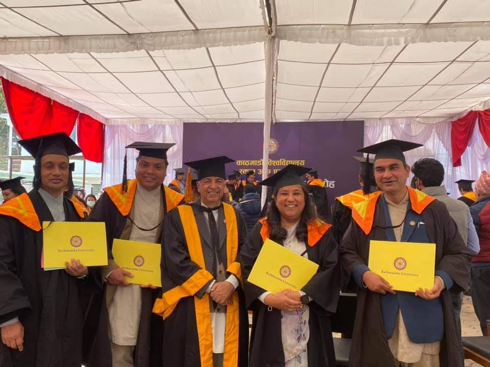 4 graduates with the dean